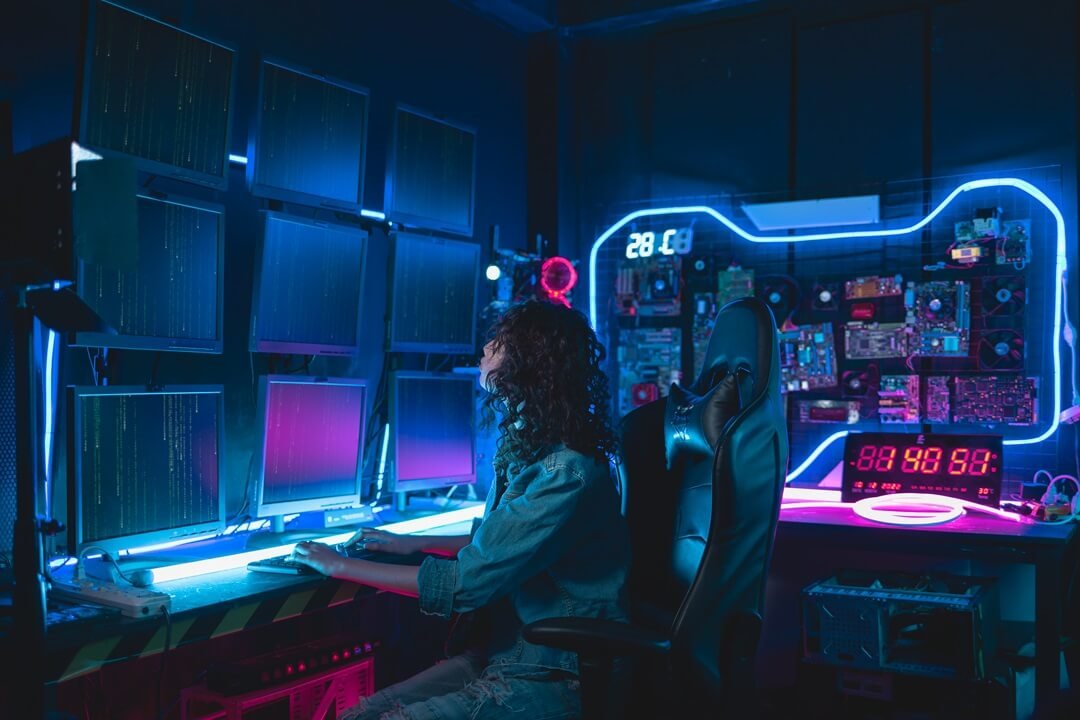 Programmer working at a computer, real-time 3D cinematics course